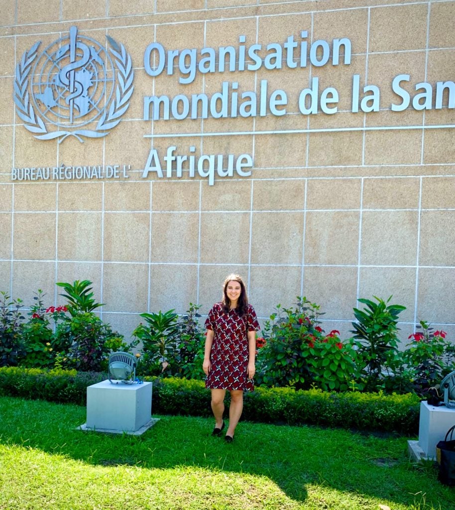 Luisa Ferrari poses in front of flowers at the WHO regional office in the Republic of the Congo