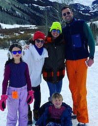 Elizabeth Ann Keating with family, including husband Kevin Keating (B'01) in front of a snowy mountain
