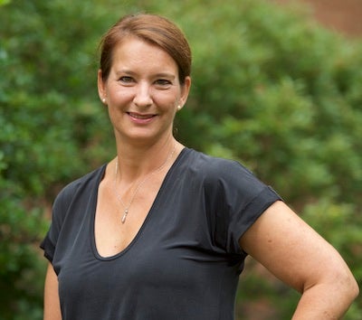 Dr. Myriam Vuckovic poses in a portrait-style photo in front of a tree