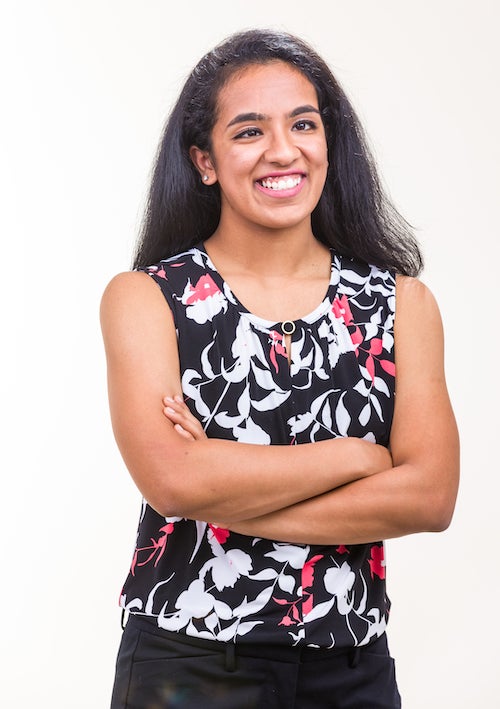 Global health major Shreyaa Venkat in a photograph standing in front of a neutral background.