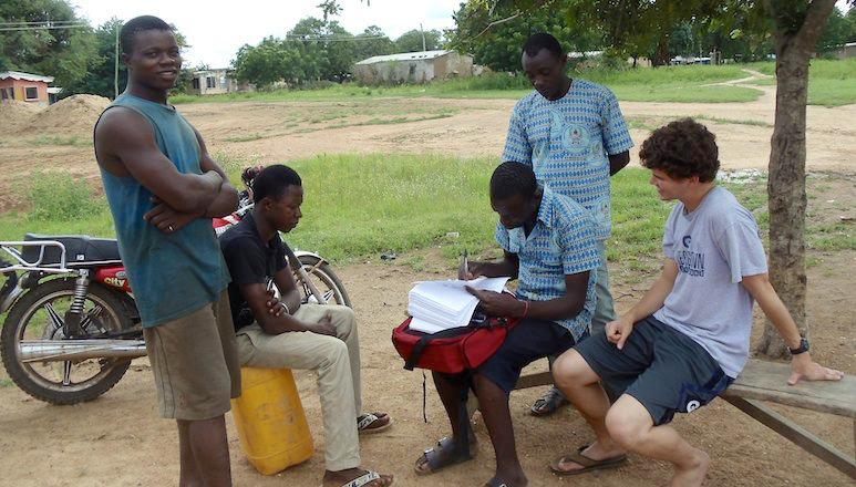 A student assists with research in Ghana
