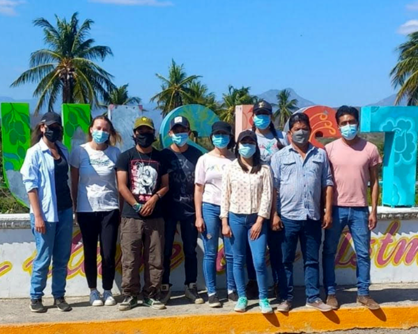 A group of students and researchers stand together