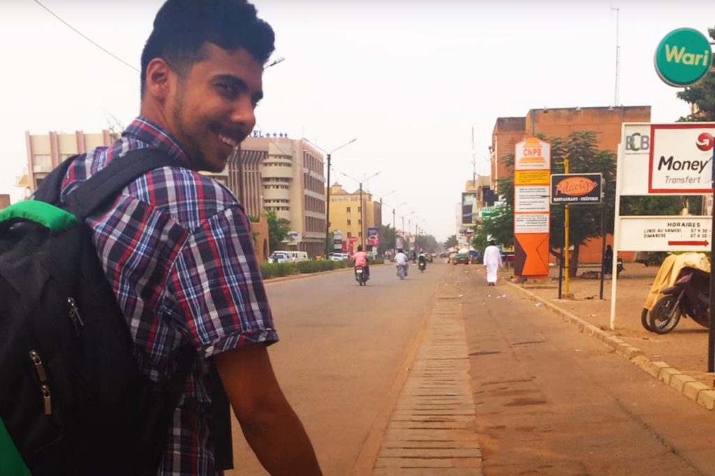 A man walks down a street in Africa