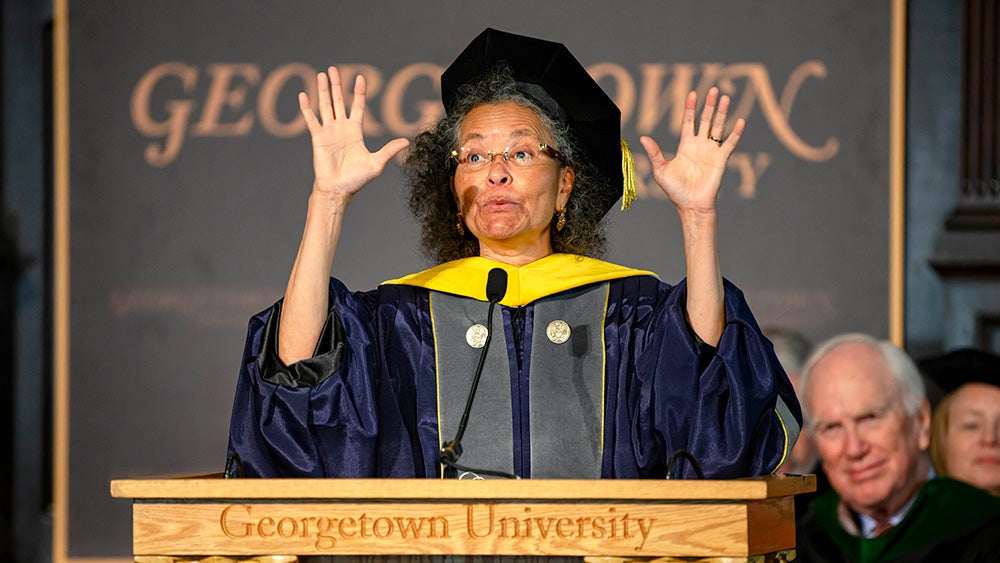 Camara Phyllis Jones speaks at a podium