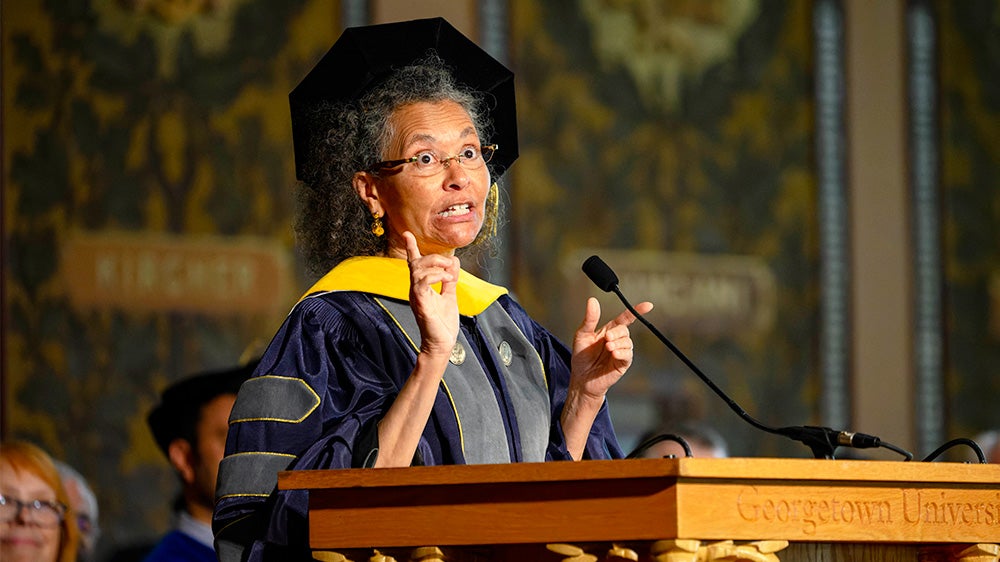 Camara Phyllis Jones speaks at a podium