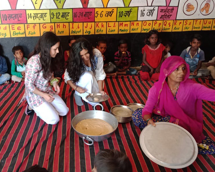 Georgetown students share food with Indian women and children