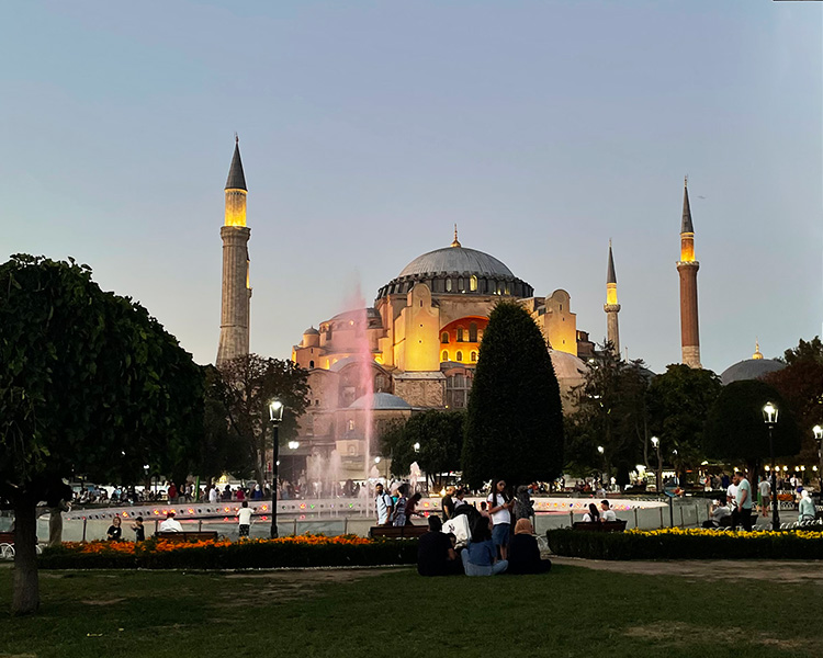 The Hagia Sophia mosque with fountain and people in the foreground