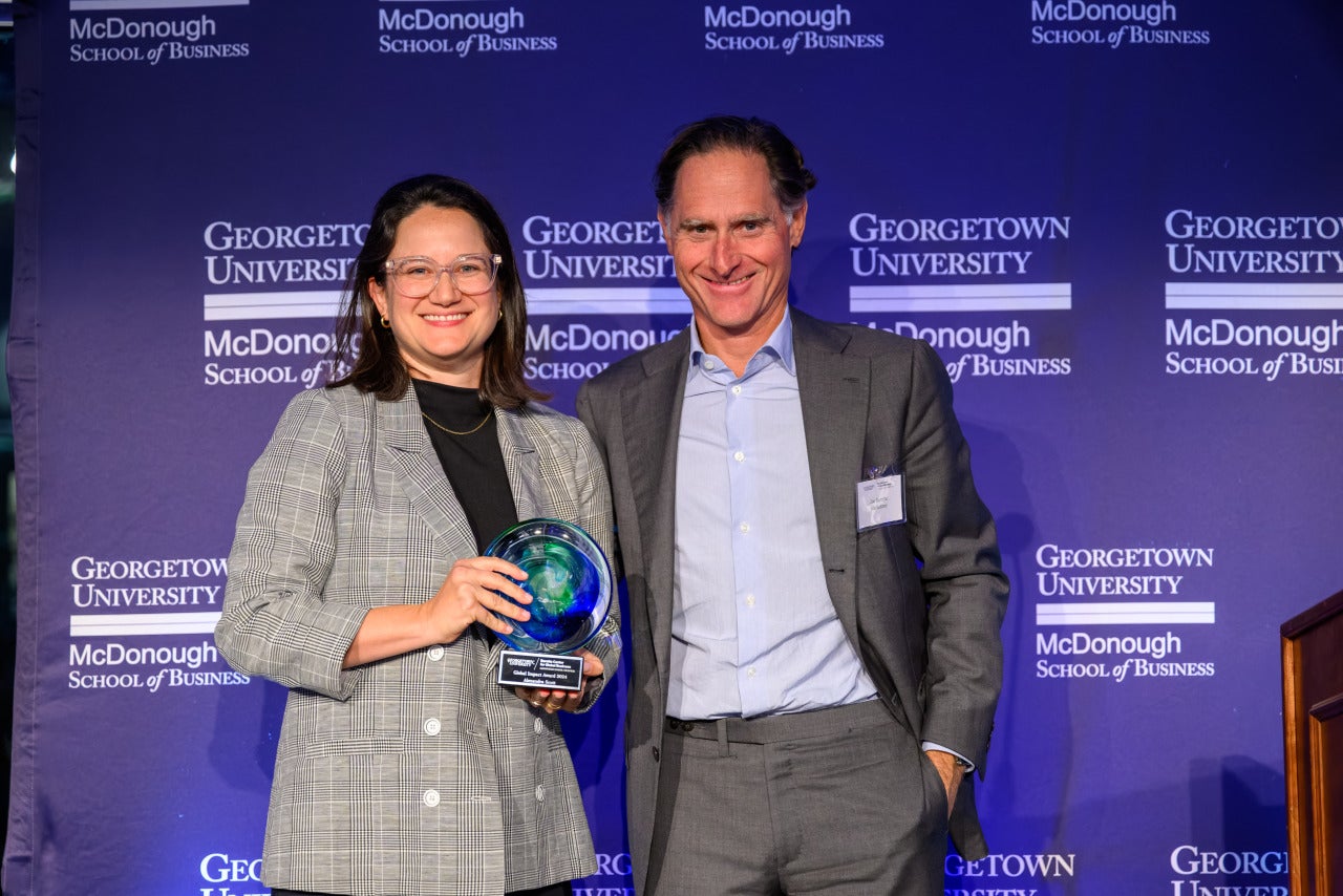 Alexandra Scott (NHS’10, G’15) receiving an inaugural Georgetown Baratta Center Global Impact Award.