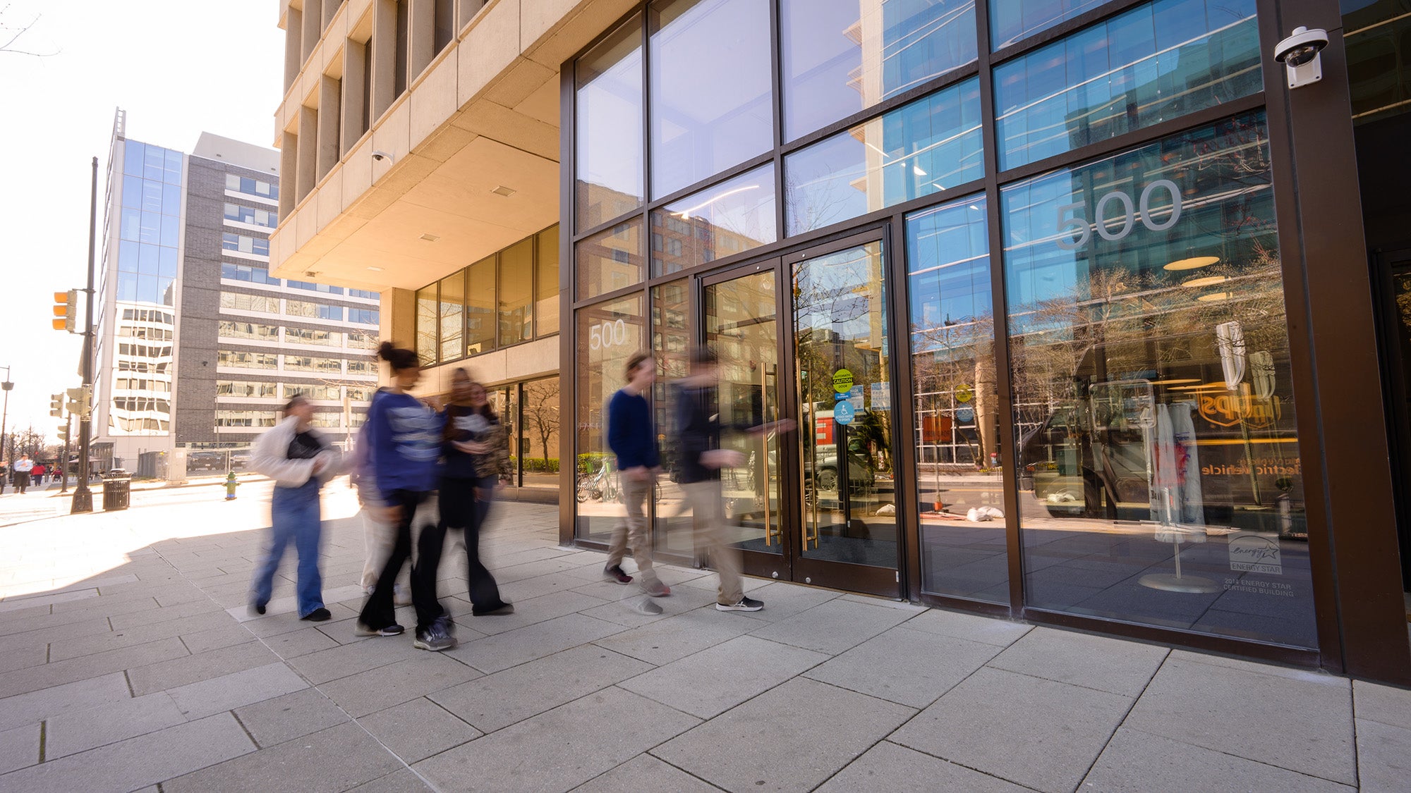 Students walk through the front door of the 500 First Street Building on Georgetown's Capitol Campus