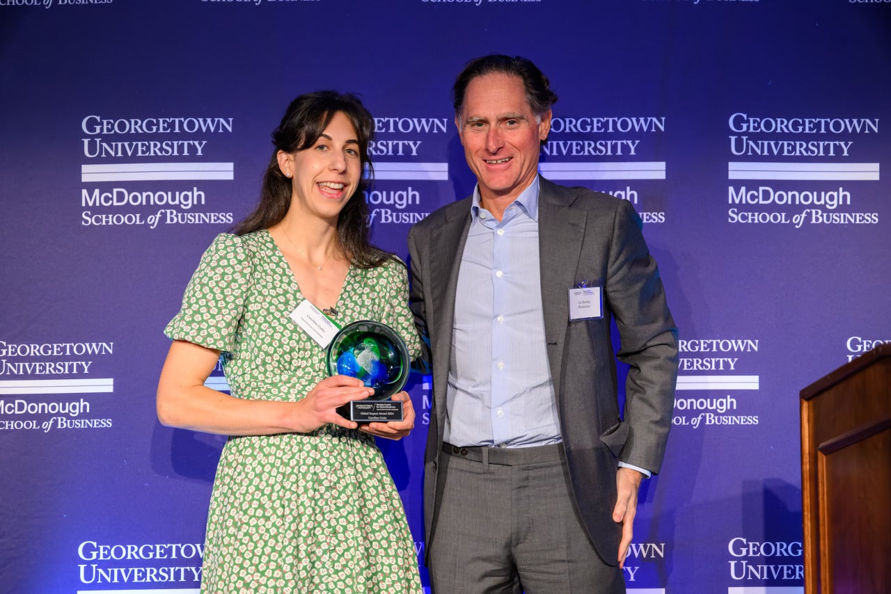 Caroline Cotto (NHS’14) receiving an inaugural Georgetown Baratta Center Global Impact Award.