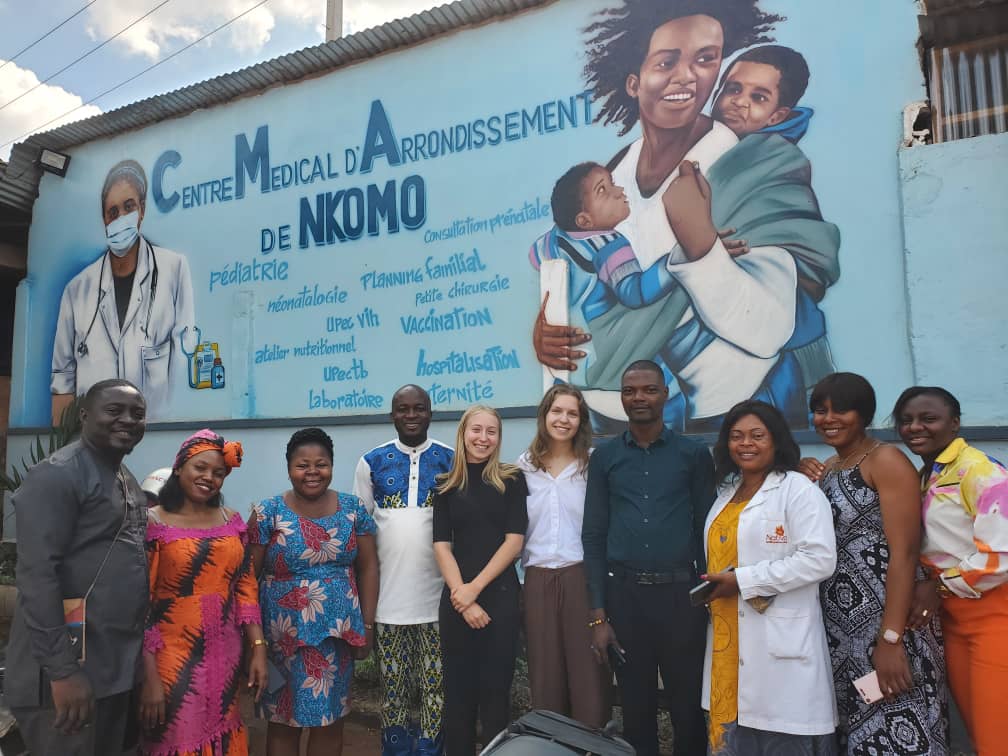 Group of health researchers against mural in Yaounde, Cameroon