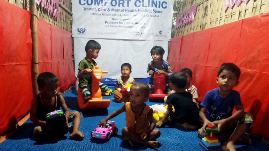 Children play with toys in the Comfort Clinic space