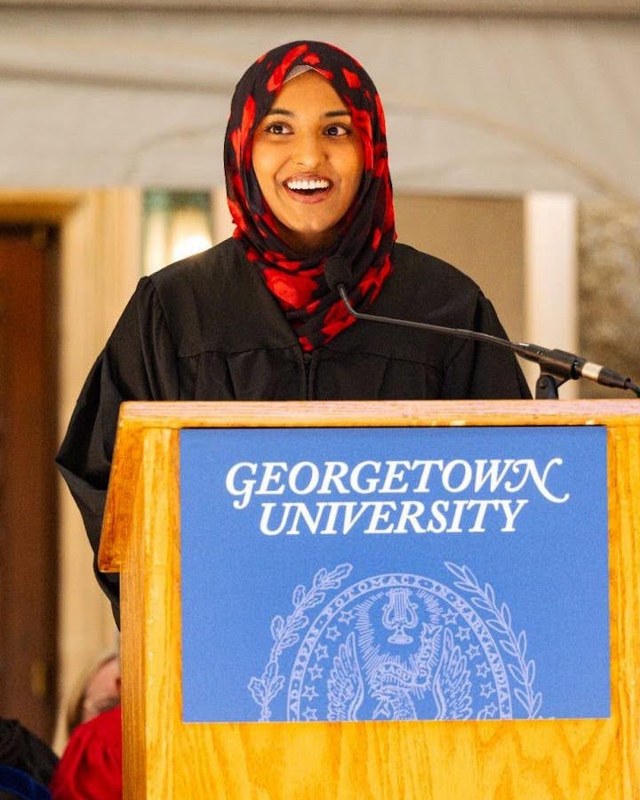 Isra Satiar speaks from a podium at Student Convocation