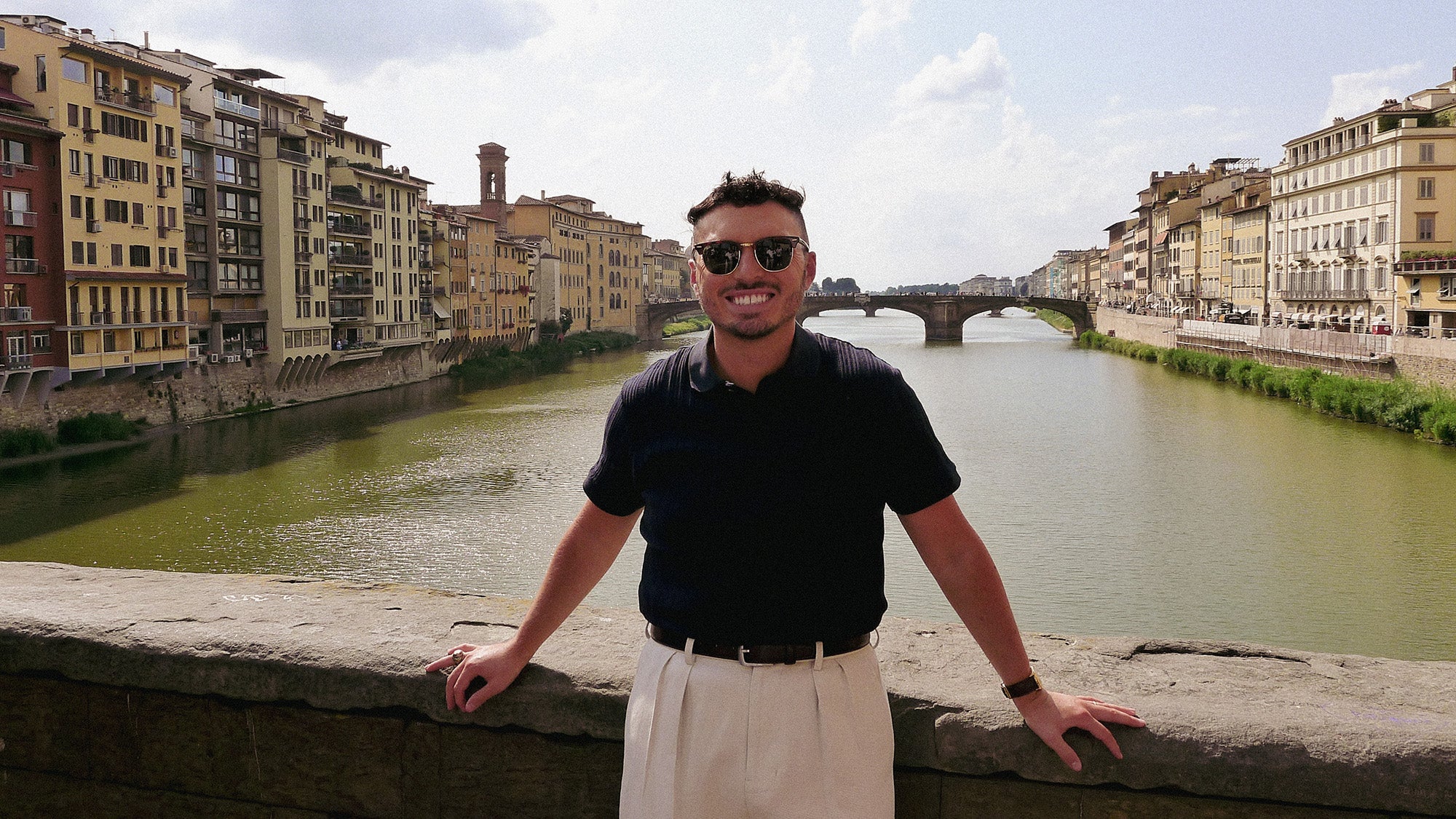 Bryson Daniels-Stevens stands on a bridge over a river