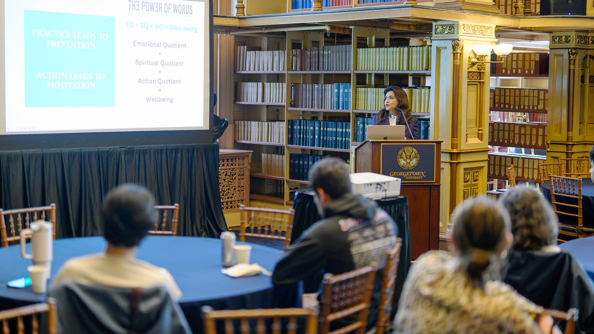 A speaker addresses a group in Riggs Library
