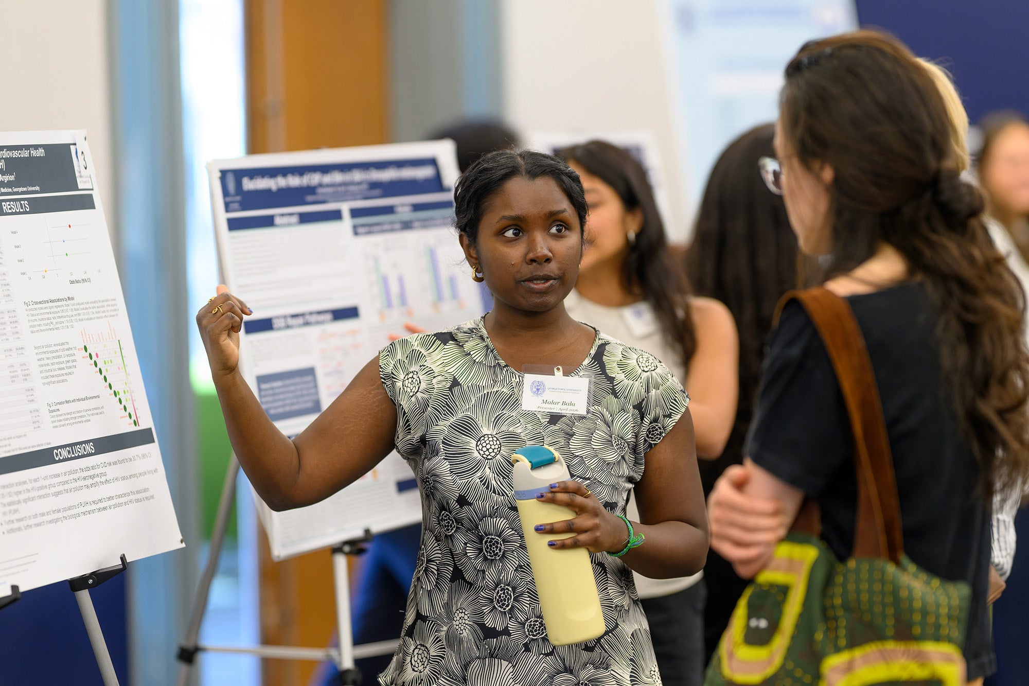 Malar Bala explains her research to an attendee