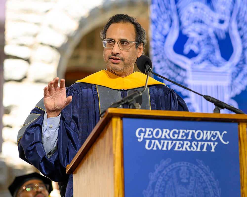 Dr. Mate speaks from a podium
