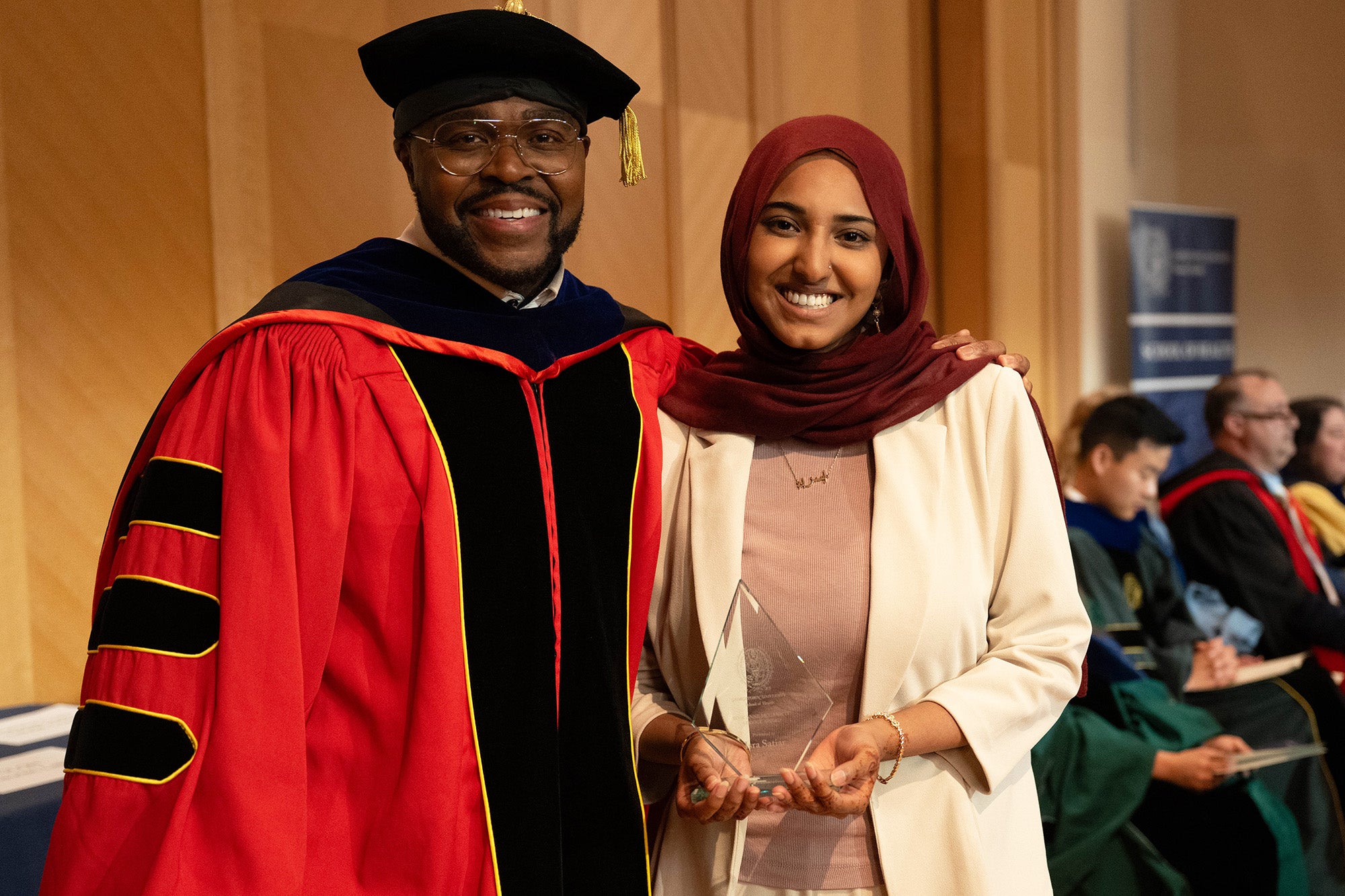 Dean King and Isra Satiar stand together
