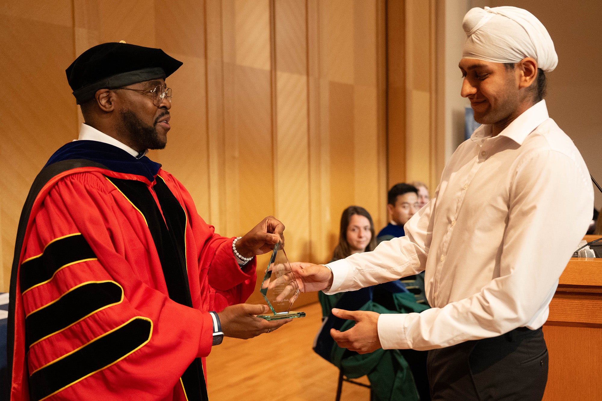 Jaskirit accepts an award from Dean King