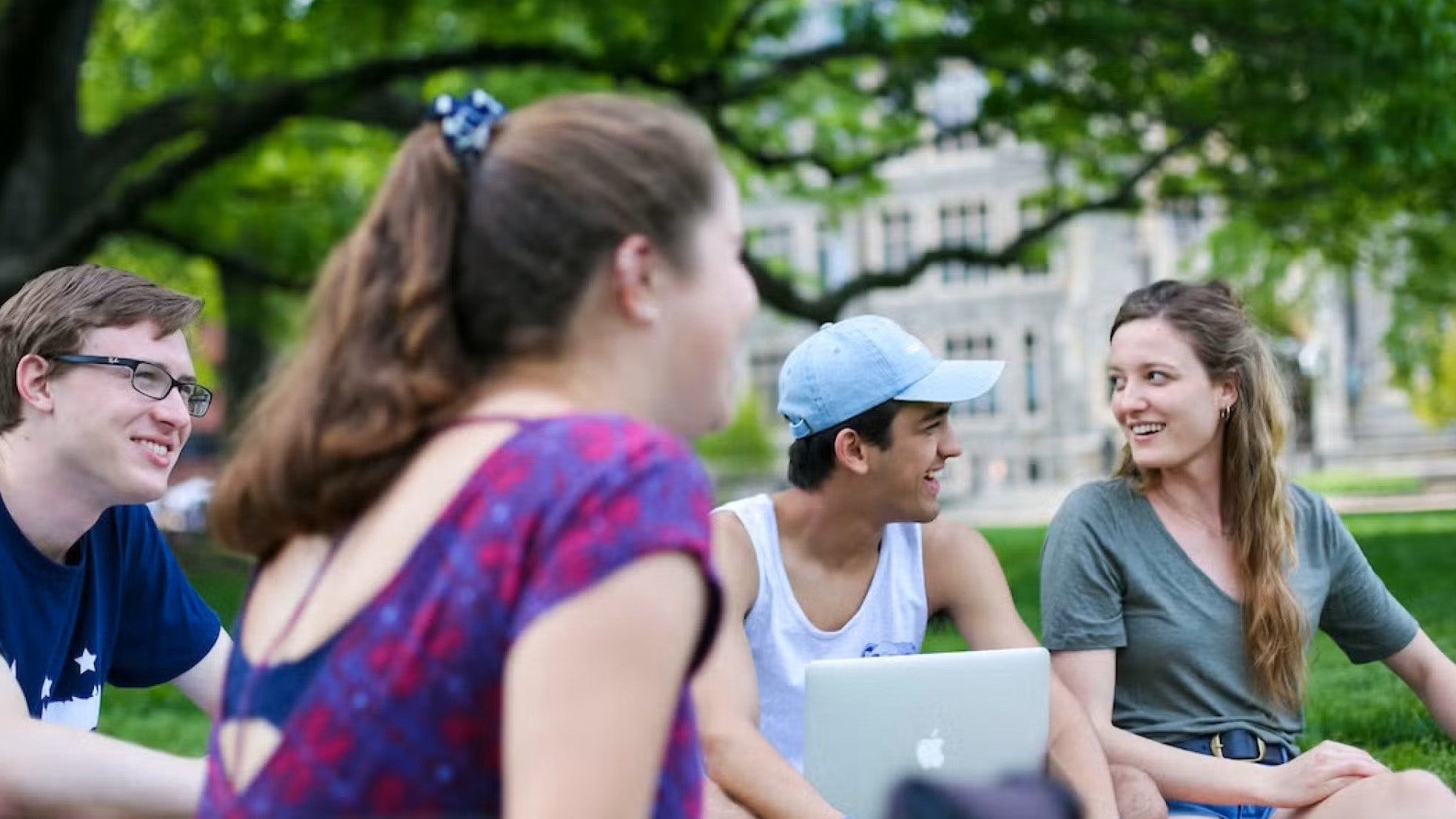 Students talk outdoors on campus